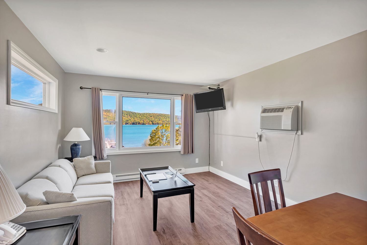 Living room with pull-out sofa and lake view