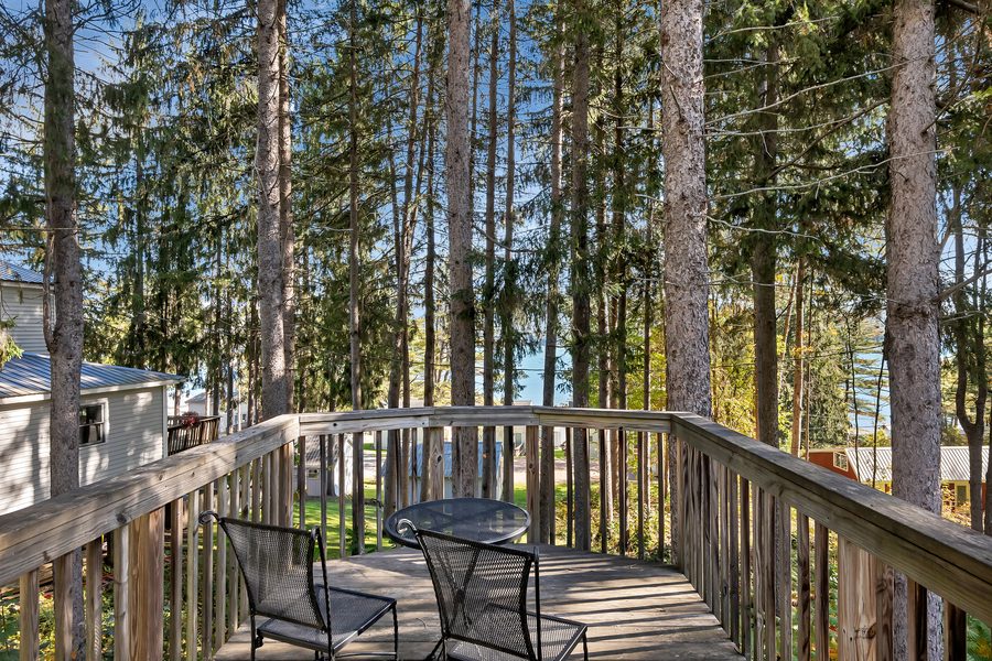 Room 29's private deck among the pines